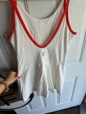 White Romper with Bright Orange Trim